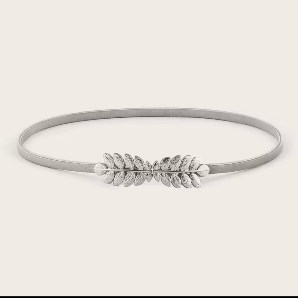 Silver tone Elastic Stretch Waist Belt, featuring a leaf-shaped buckle design.